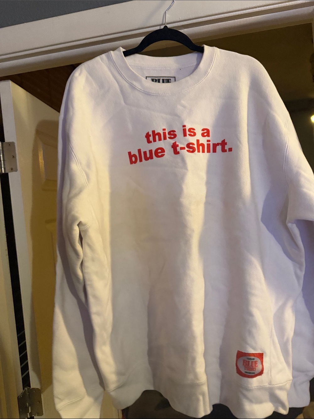 White Crewneck Sweatshirt with Bold Red Text